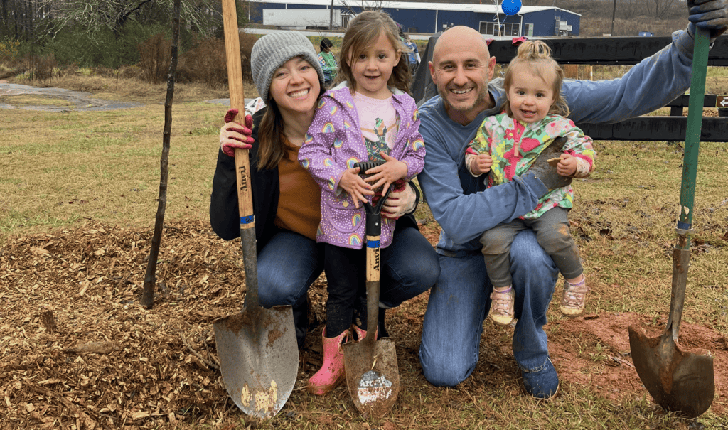 Family planting trees
